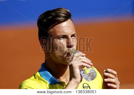 BARCELONA - APRIL,19: Hungarian tennis player Marton Fucsovics in action during a match of Barcelona tennis tournament Conde de Godo on April 19, 2016 in Barcelona