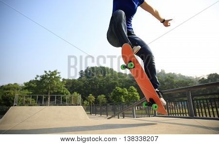 closeup of one skateboarder at skate park ramp