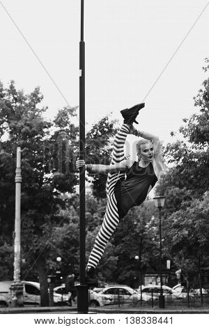 Dancer in the city. The choreography in the air. Black and white.