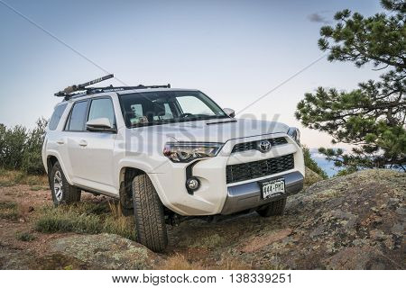 CHEROKEE PARK, CO, USA - JUNE 12, 2016: Toyota 4Runner SUV (2016 Trail edition) on a rocky  trail in Colorado's Rocky Mountains