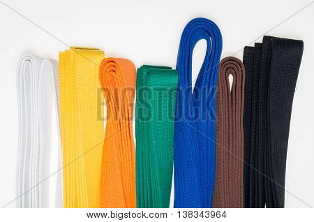 colored belts in martial arts and a part of judo uniform for an almost abstract background