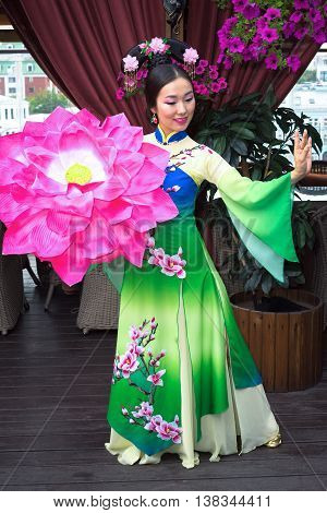 Beautiful Asian Girl In Traditional Chinese Dress And Floral Parasol