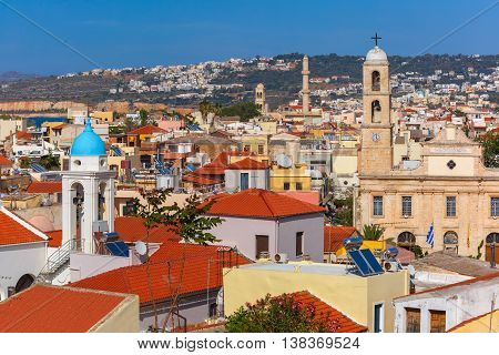 The medieval city with Orthodox cathedral Trimartiry, aerial view from Schiavo Bastion in the sunny morning, Crete, Greece