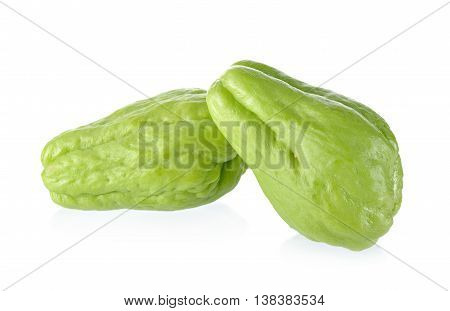 uncooked whole fresh chayote on white background