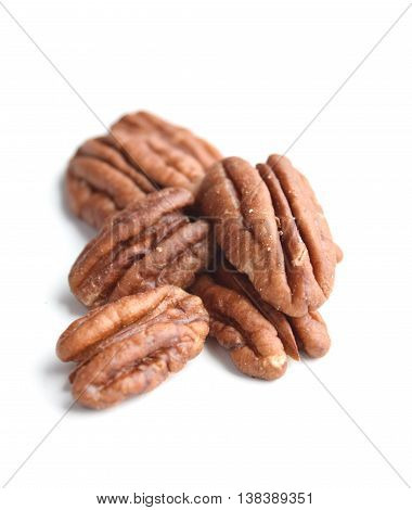 Pile of pecans (carya illinoinensis) isolated on white background