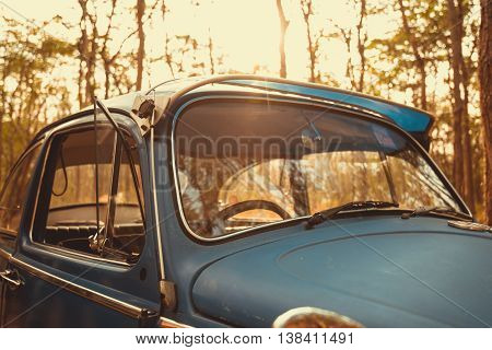 Vintage Car Volkswagen Retro Blue Color In Forest Leaves Brown