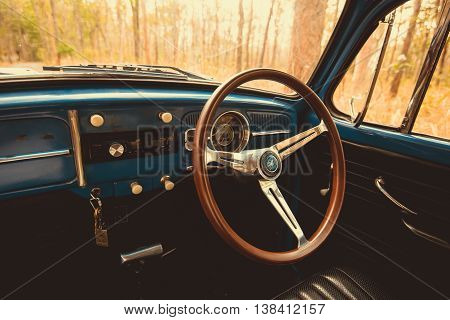 Vintage Car Volkswagen Retro Blue Color In Forest Leaves Brown