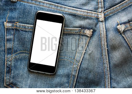 Mobile phone with blank screen for copy space, on back pocket faded jeans