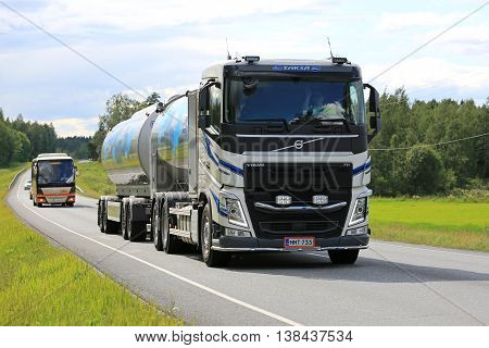 TAMMELA, FINLAND - JULY 9, 2016: New Volvo FH milk tanker transports Valio milk on scenic summer road in South of Finland. The usual temperature of transported milk is 3 degrees Celsius.