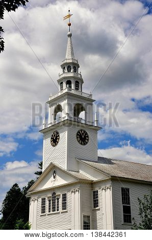 Hancock New Hampshire - July 11 2013: First Congregational Church built in white clapboard colonial New England style with a tiered steeple and belltower holding Paul Revere's Bell 