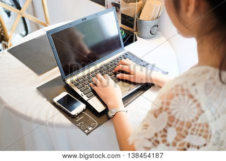 Freelance E Business Asian Women Using Laptop Computer In Coffee Shop