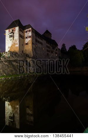 Night-Time Portrait of Castle Matzen Reflected on Water