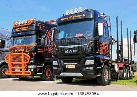 PORVOO, FINLAND - JULY 2, 2016: MAN TGX 39.560 D38 and new Scania Logging trucks of Kuljetus T&P Immonen Oy on Riverside Truck Meeting 2016.