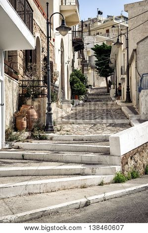 Street with stony steps at old town of Sitia town on Crete island, Greece