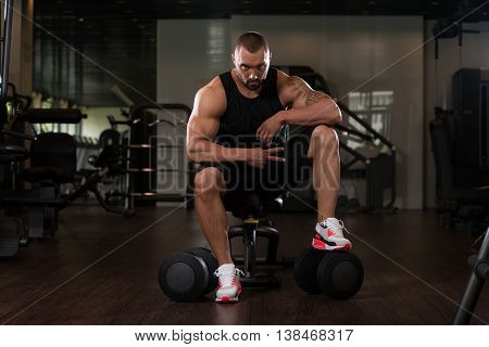 Muscular Man Resting On The Bench