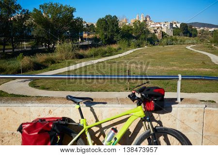 Ribarroja del Turia village from old stone bridge with bicycle at valencia spain