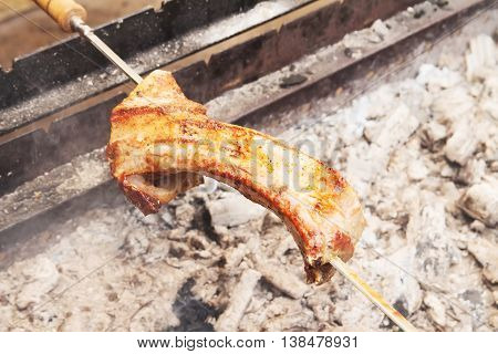 Grilled meat roasted skewers barbecue. Barbeque churrasco meat background. Appetizing meat roasted BBQ grill.