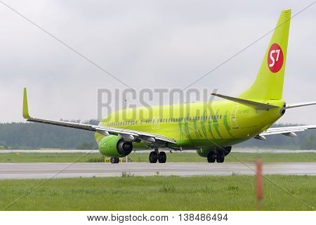 MOSCOW, RUSSIA - MAY 19, 2016: Aircraft Boeing737 S7 Airlines taxiing. Plane makes taxiing on taxiway Domodedovo International Airport.