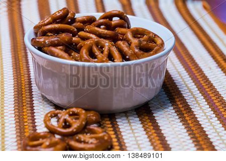 Small miniature salty snack pretzels.in a bowl