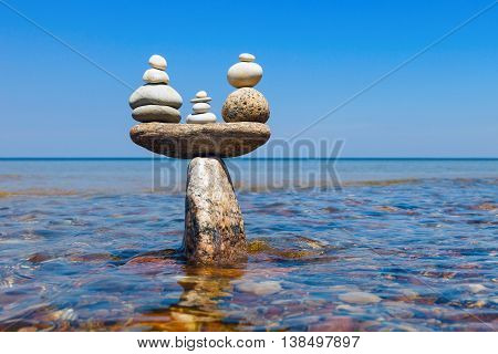 Concept of tranquility and balance. Rock zen in the form of scales