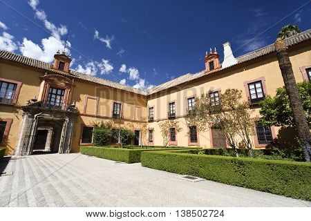 SEVILLE, SPAIN - September 12, 2015: View of the Patio del Crucero the garden that owes its name to its cross shape in Alcazar of Seville on September 12, 2015 in Seville, Spain