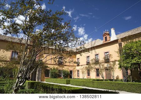 SEVILLE, SPAIN - September 12, 2015: View of the Patio del Crucero the garden that owes its name to its cross shape in Alcazar of Seville on September 12, 2015 in Seville, Spain