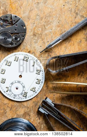 Various Horologists Tools With A Clock Dial