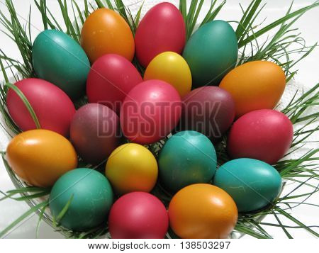 Natural eggs dyed and arranged on a plate for Easter