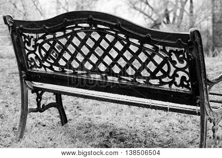 ice coated park bench winter blizzard solitary