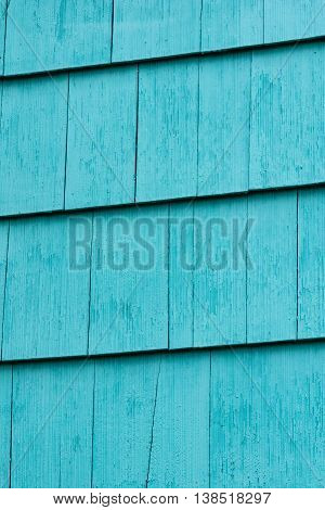 blue painted wooden plank fence, or roof, or wall