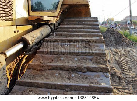 hydraulic hoses on a piston against the hydraulic system in the bulldozer