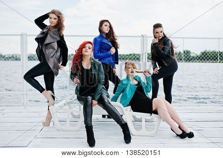 Five Beautiful Young Girls Models At Leather Jackets Posing On Berth.