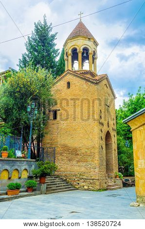 TBILISI GEORGIA - MAY 28 2016: The brick bell tower of the Georgian Orthodox Jvris Mama Church on May 28 in Tbilisi.