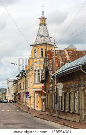 Old wooden houses in small street corner. Rakvere, Estonia.