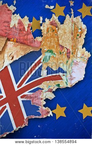 Grunge paper with UK flag on the wallpaper break away from the European Union. Concept Brexit. Old grunge tattered wall cover in a ruined house.