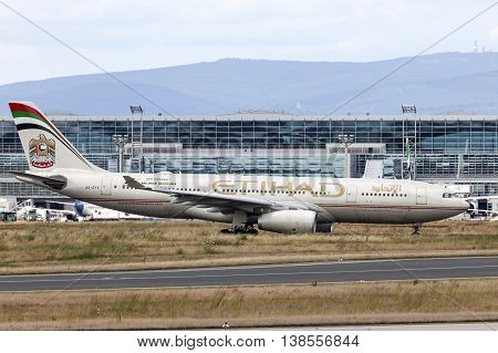 FRANKFURT GERMANY - JULY 12 2016: Etihad Airway Airbus A330 in front of the terminal of Frankfurt Main international airport