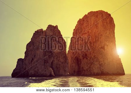 Faraglioni Cliffs in Capri at sunset - Italy, Europe