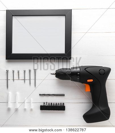 Blank Black frame with blank copy space. Driller with photo frame equipments.