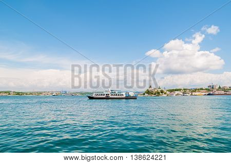 Passenger boat ferry on the sea water in the city center