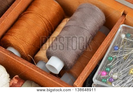 Threads On Wooden Box
