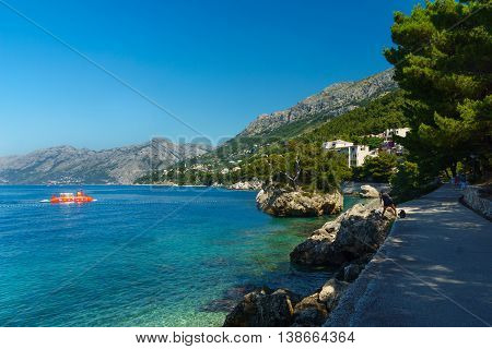 Coast in Brela. Brela is a seaside resort on the Makarska Riviera