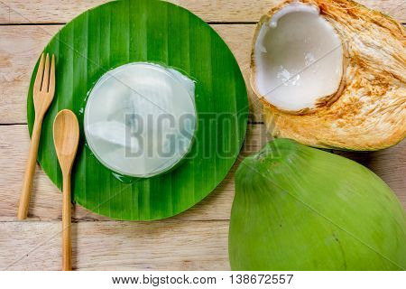coconut jelly and wooden spoon on wooden background