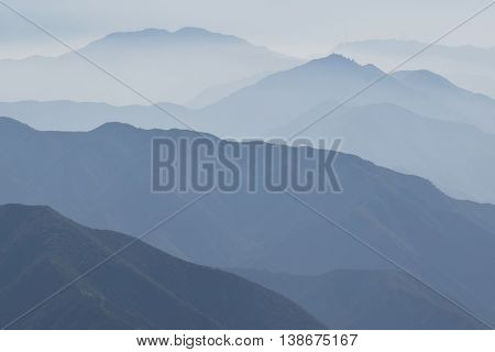 Haze surrounding mountain ridges taken in the San Gabriel Mountains, CA which is a typical Southern California weather pattern