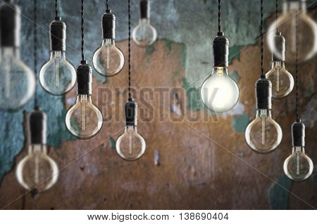 Idea And Leadership Concept Vintage Incandescent Edison Bulbs On Color Background