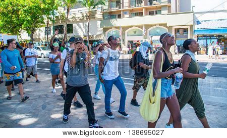Honolulu, HI. USA  July 9, 2016  Approximately fifty or so Black Lives Matter protesters hit the strip in Waikiki on Saturday afternoon with chants of 