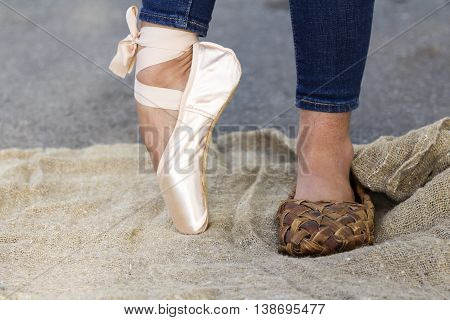 Feet girl in Ballet shoes and Bast shoe on canvas on the road