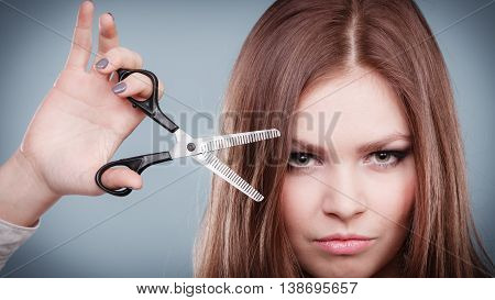 Professional Hairdresser Dual Wielding Scissors.
