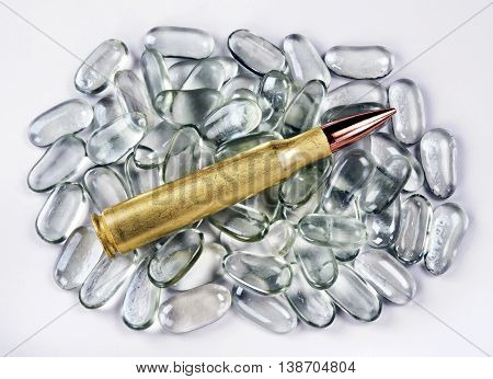 50 caliber brass bullet on polished glass stones.