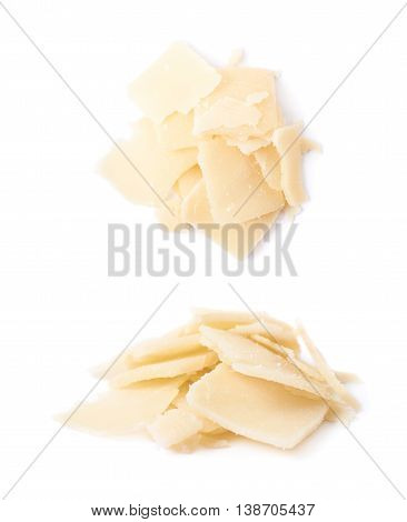Pile of parmesan cheese flakes isolated over the white background, set of two different foreshortenings