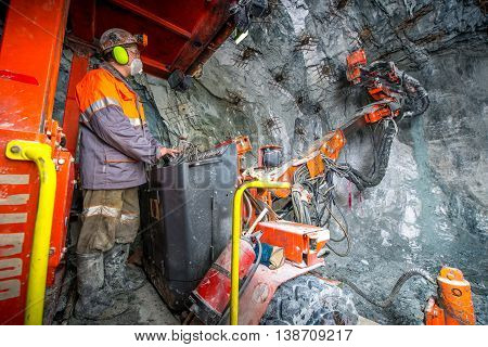 Gold mining underground inside a tunnel. russia
